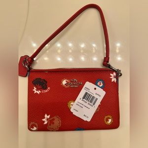 Brand new with tags. Beautiful red coach coin purse.